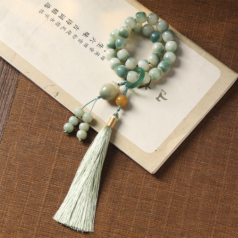 Floating flowers and weathered bodhi roots with carrot pendants and hand-held bracelets