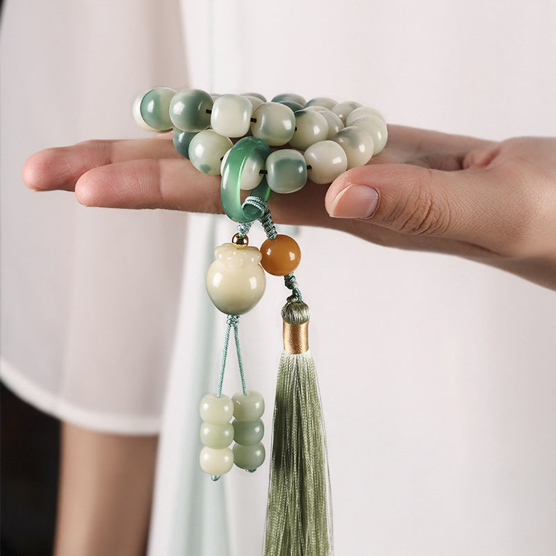 Floating flowers and weathered bodhi roots with carrot pendants and hand-held bracelets